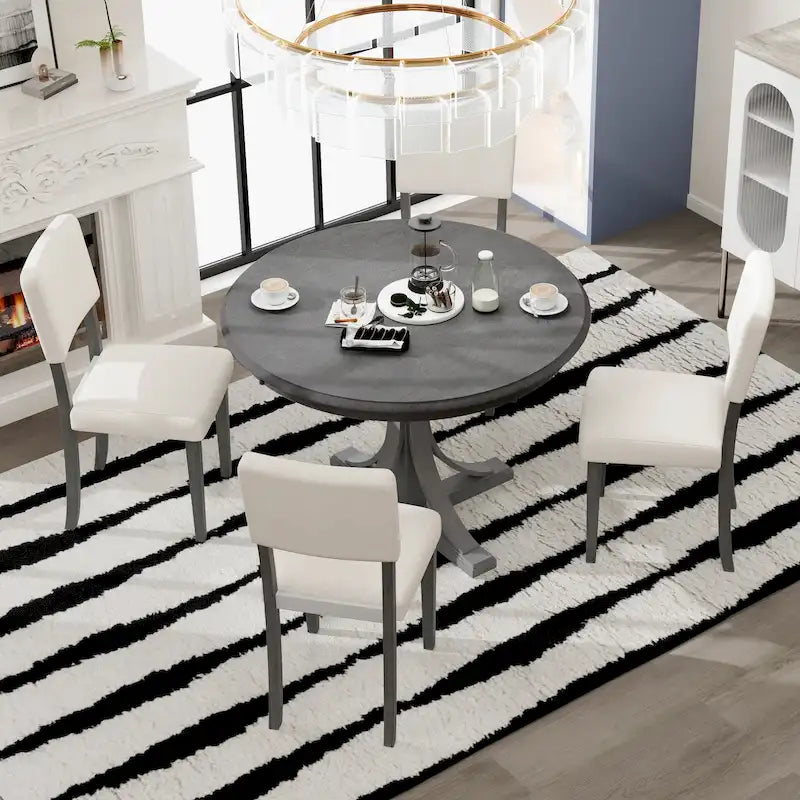 Table à manger ronde avec pieds tréteaux incurvés